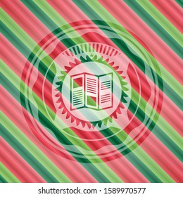 brochure icon inside christmas colors badge.