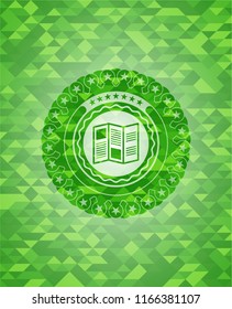 brochure icon inside green emblem with mosaic background