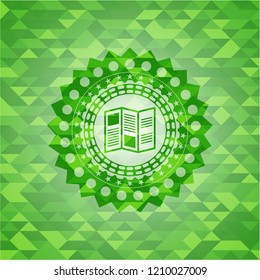 brochure icon inside green emblem with triangle mosaic background