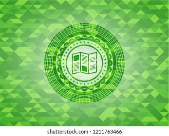 brochure icon inside green emblem with mosaic ecological style background
