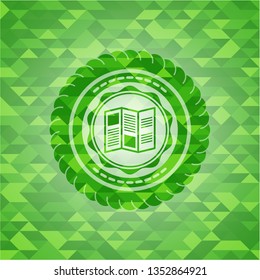 brochure icon inside green emblem with mosaic background