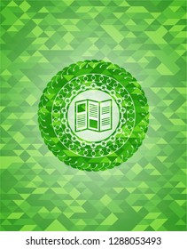 brochure icon inside green mosaic emblem