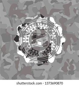 brochure icon inside grey camouflaged emblem