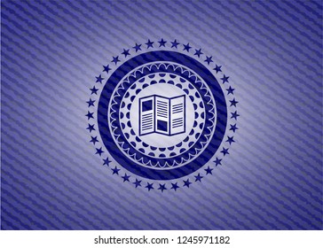 brochure icon inside jean or denim emblem or badge background