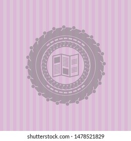 brochure icon inside pink emblem