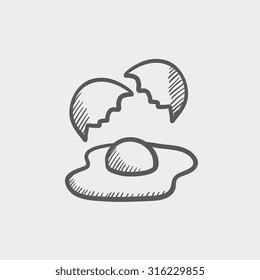 Broken egg and shells sketch icon for web, mobile and infographics. Hand drawn vector dark grey icon isolated on light grey background.