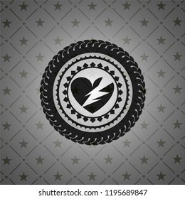 broken heart icon inside black badge