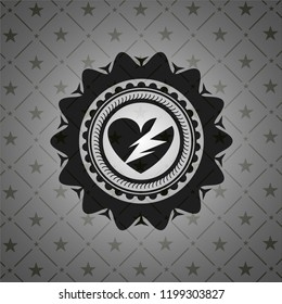 broken heart icon inside black emblem