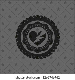 broken heart icon inside black emblem