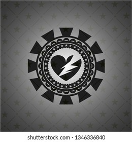 broken heart icon inside black emblem