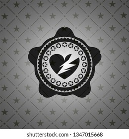 broken heart icon inside black badge