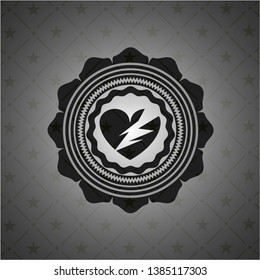 broken heart icon inside black emblem