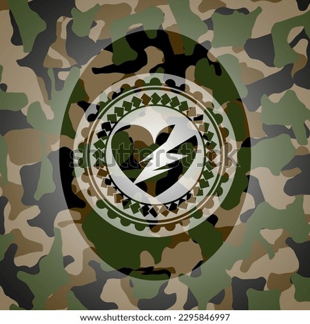 broken heart icon inside camouflage emblem. 