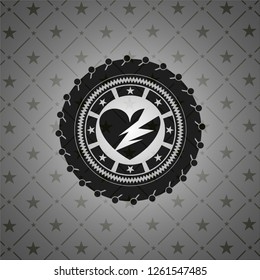 broken heart icon inside dark badge or emblem