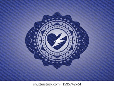 broken heart icon inside denim background