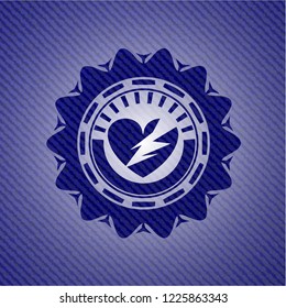 broken heart icon inside emblem with jean high quality background