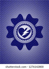broken heart icon inside emblem with denim texture