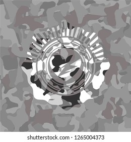 broken heart icon inside grey camouflage emblem