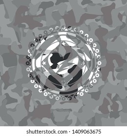 broken heart icon inside grey camouflage texture