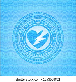 broken heart icon inside light blue water wave style badge.