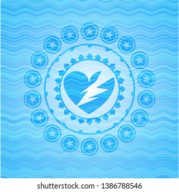 broken heart icon inside light blue water style emblem.