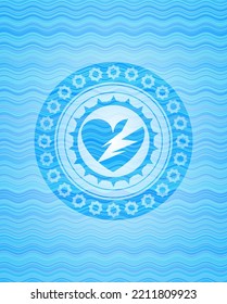 broken heart icon inside light blue water emblem background. 