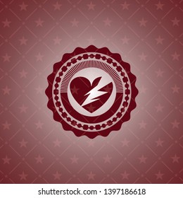 broken heart icon inside red emblem