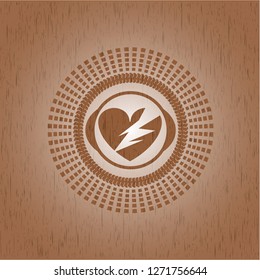 broken heart icon inside retro wood emblem
