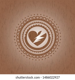 broken heart icon inside retro wooden emblem