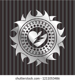 broken heart icon inside silver emblem