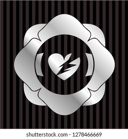 broken heart icon inside silver emblem