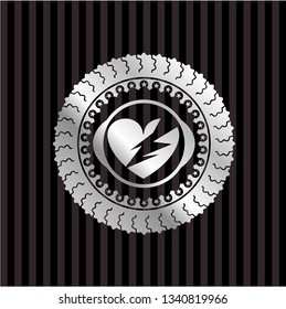 broken heart icon inside silver emblem