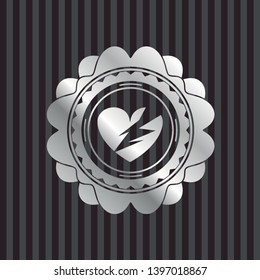 broken heart icon inside silver shiny emblem