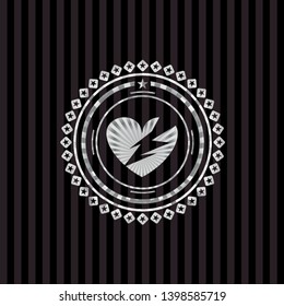 broken heart icon inside silver emblem