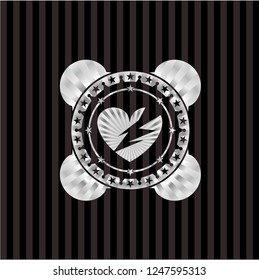 broken heart icon inside silvery emblem or badge