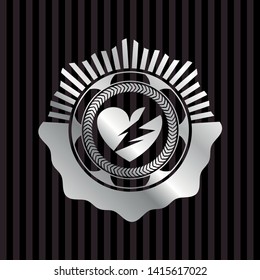 broken heart icon inside silvery shiny badge