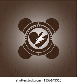 broken heart icon inside vintage wood emblem
