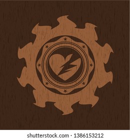 broken heart icon inside vintage wood emblem