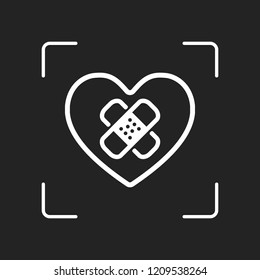 broken heart with patch. simple single icon. White object in camera autofocus on dark background