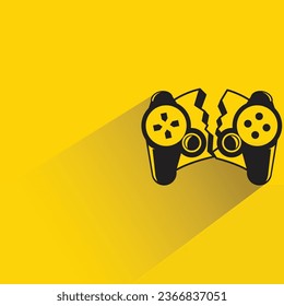 broken joystick with shadow on yellow background