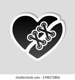 Broken and patched heart. Sticker style with white border and simple shadow on gray background