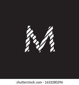broken pieces forming the letter M