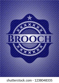 Brooch denim background