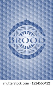 Brood blue badge with geometric pattern.