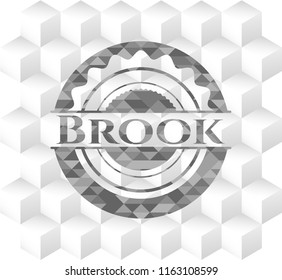 Brook grey badge with geometric cube white background
