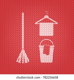 Broom, bucket and hanger sign. Vector. Knitted white icon on a red knitted background.