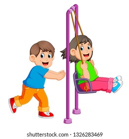 brother pushing sister on swing