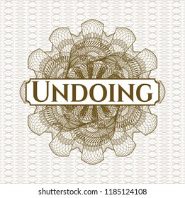 Brown abstract linear rosette with text Undoing inside