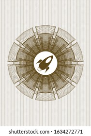 Brown abstract rosette with rocket icon inside