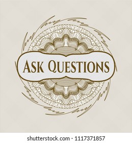Brown abstract rosette with text Ask Questions inside